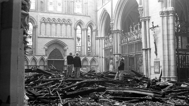 firemen-survey-the-fire-damage.jpg