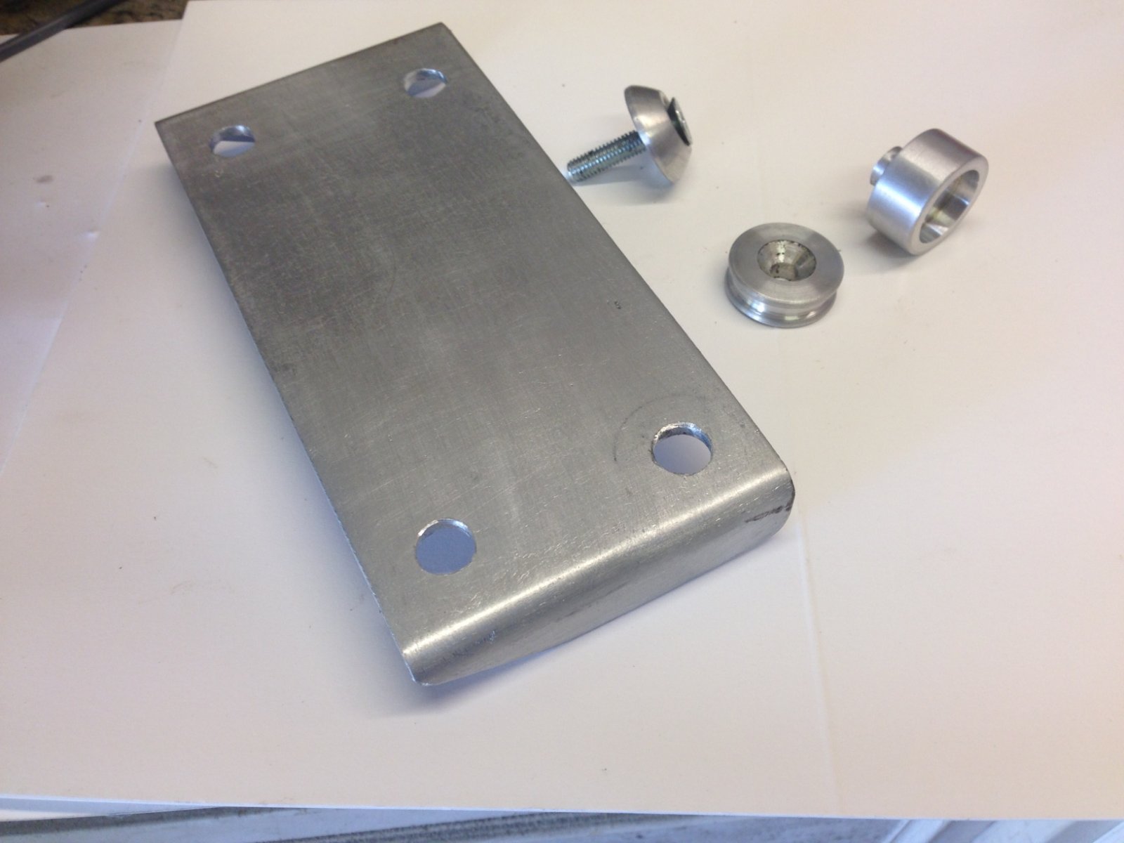 Under seat tray bracket and machined parts.JPG