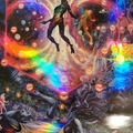 Lithograph printed on rainbow holographic mat board with UV varnish