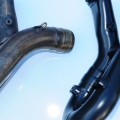 Ceramic coated rear header alongside non-coated header.